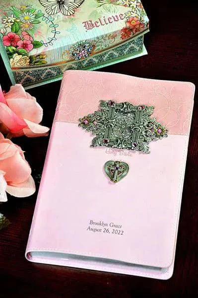 Jeweled pink baby keepsake Bible with ornate metal cross, roses, and personalized engraving