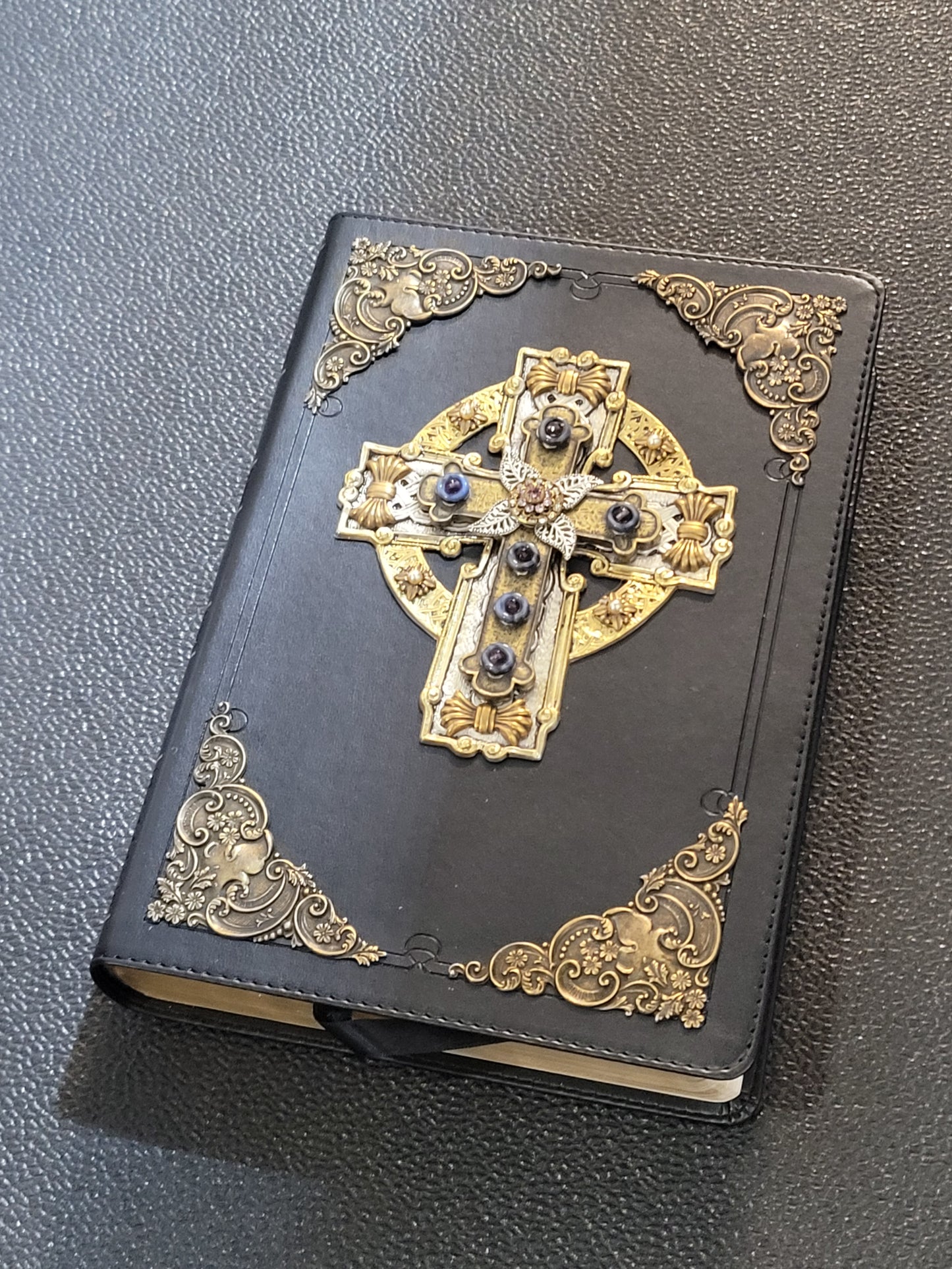 Jo Marz personal size jeweled celtic cross bible with ornate gold detailing on black cover