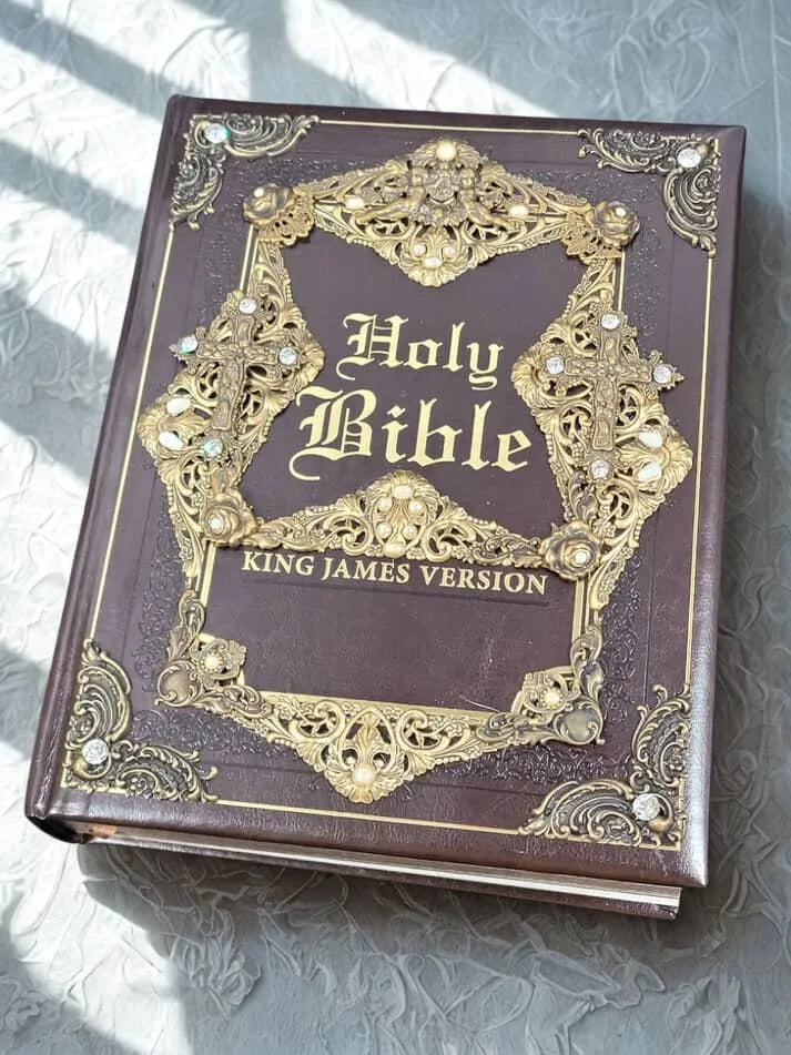 Embellished King James Version Holy Bible with ornate gold detailing and gemstones