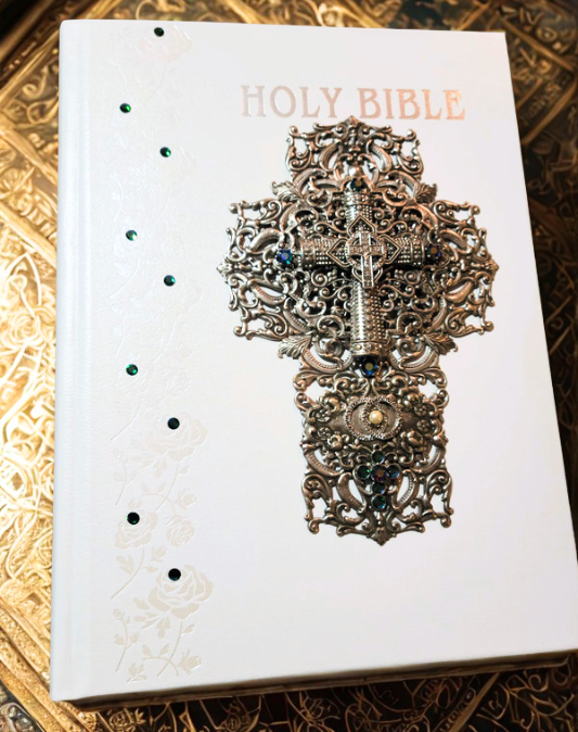 White family size jeweled Catholic wedding Bible with ornate silver cross and decorative gemstones
