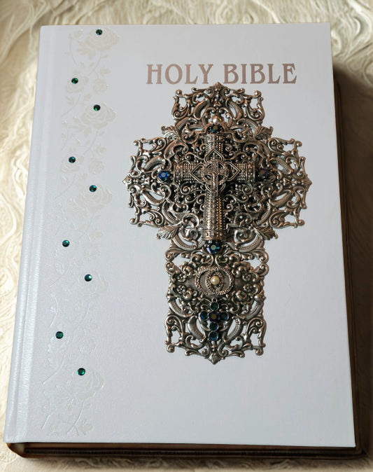Family size jeweled Catholic wedding Bible with ornate silver cross and green embellishments on white cover