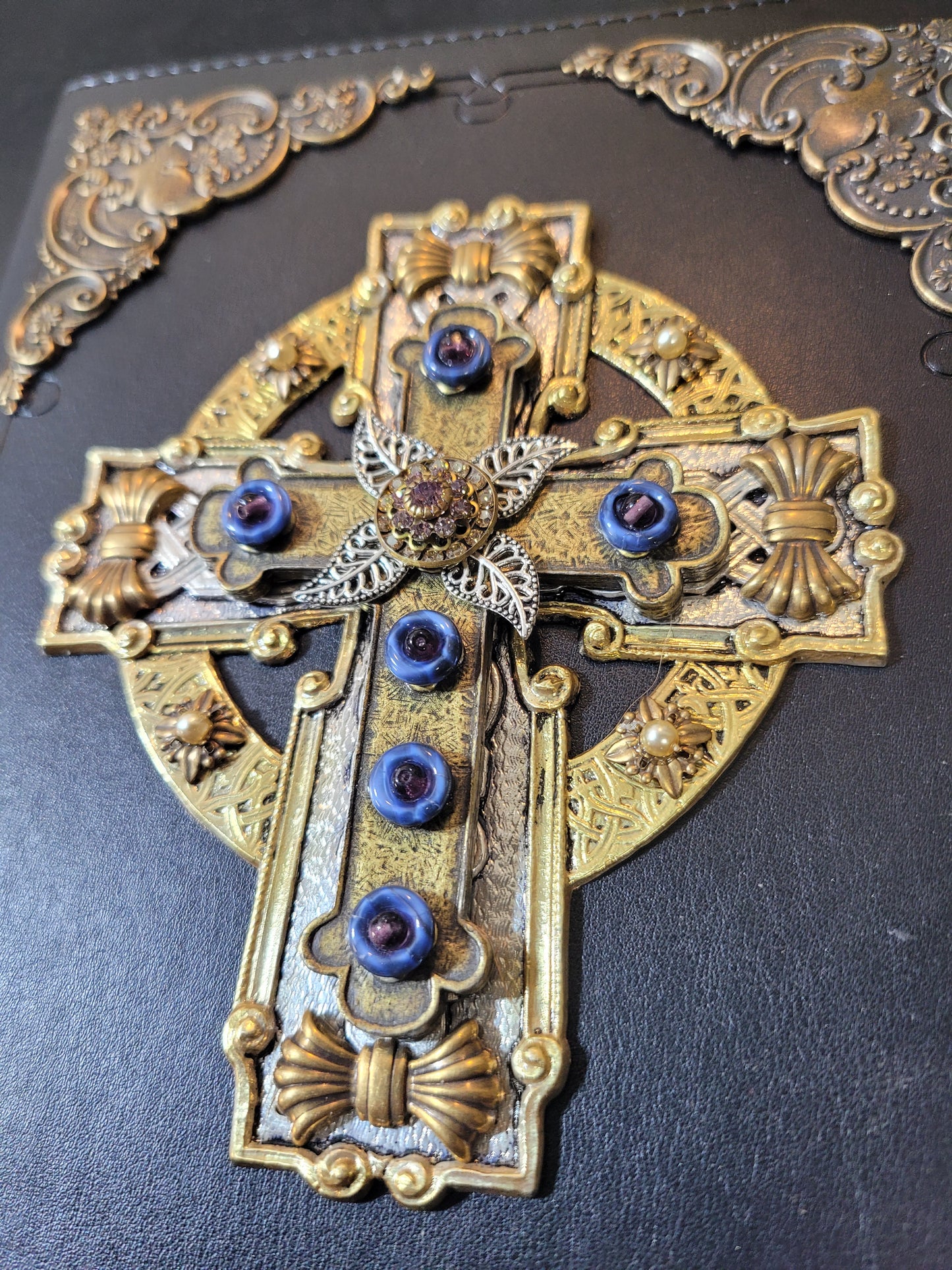 Jo Marz personal size jeweled celtic cross bible with ornate gold and blue jeweled detailing on black cover