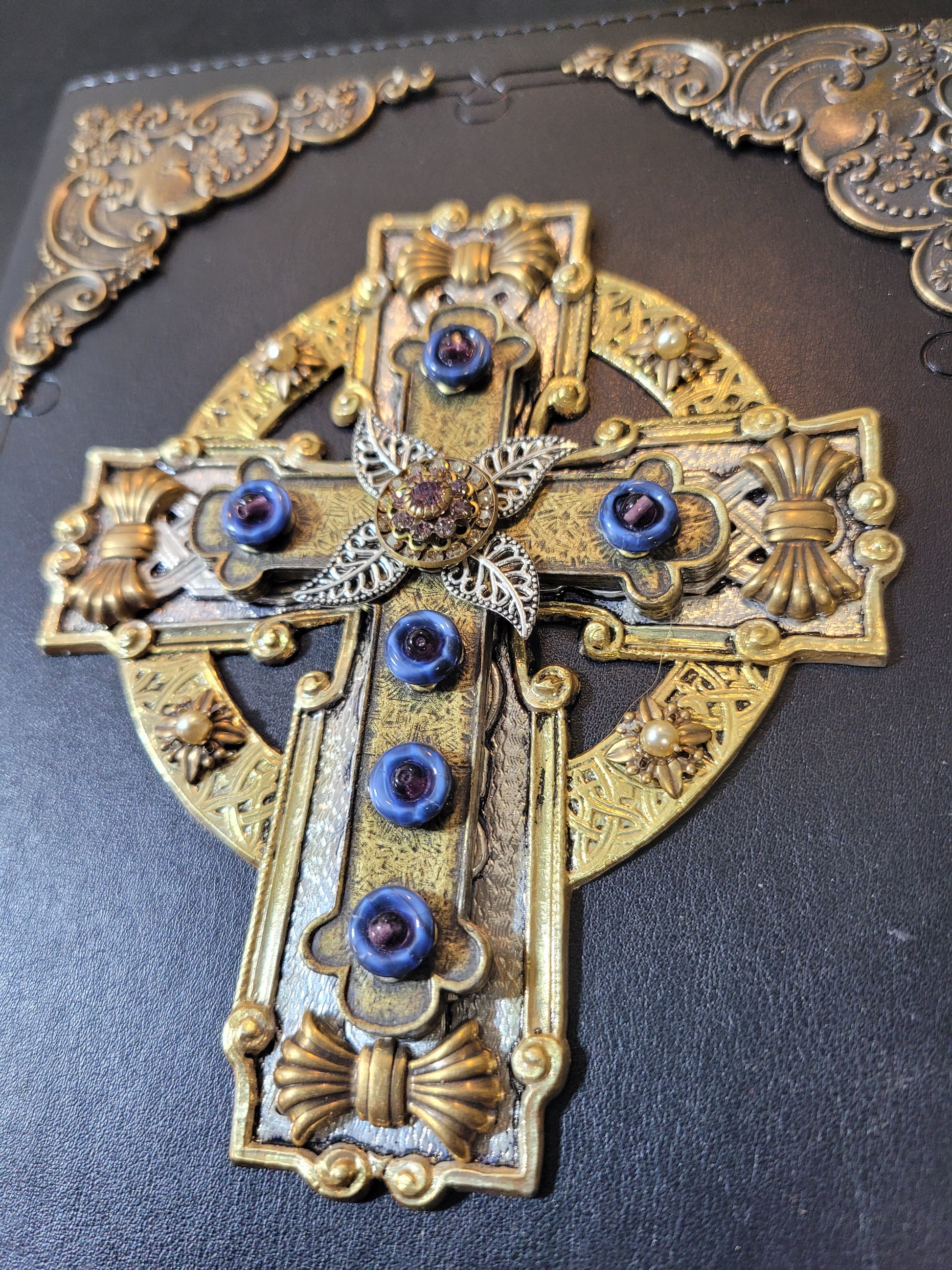 Jo Marz personal size jeweled celtic cross bible with ornate gold and blue jeweled detailing on black cover