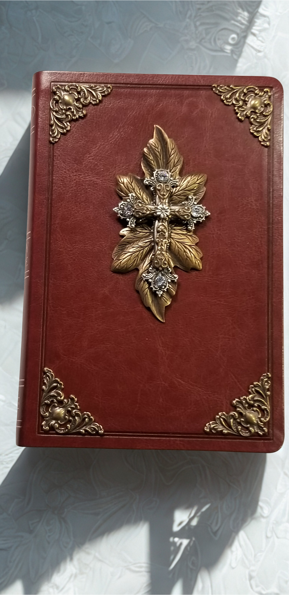 Dacole Designs personal size jeweled NKJV Bible with brown cover and ornate gold cross decoration