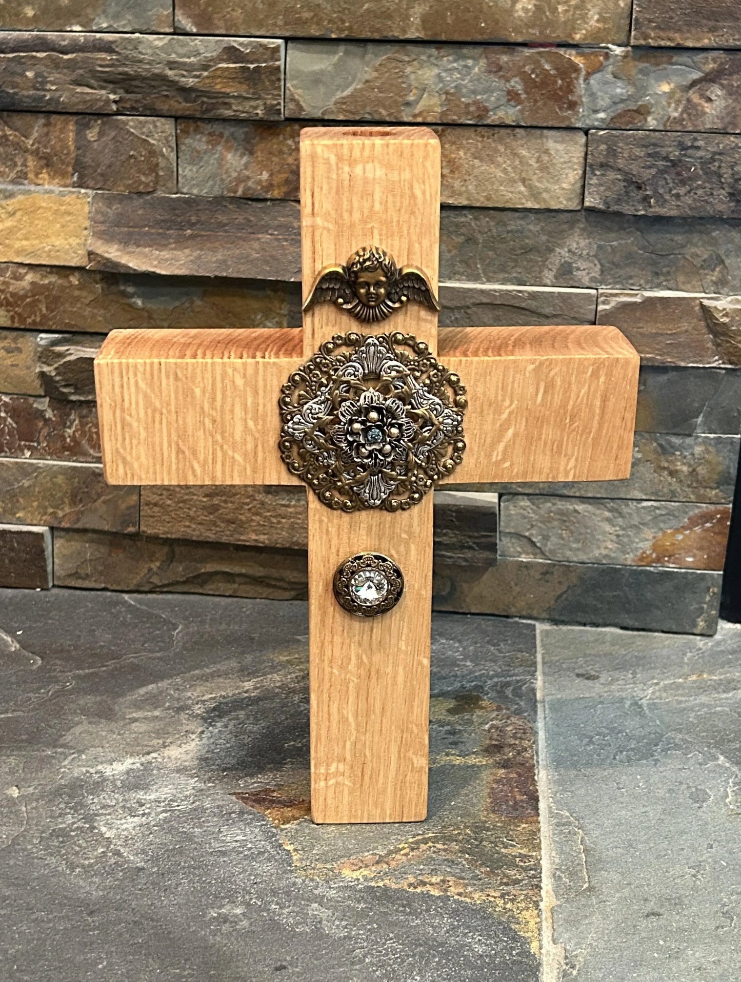 Dacole Designs jeweled oak cross wall decor with ornate metal accents on natural wood background