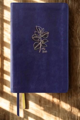NIV Women's Devotional Bible leather navy edition by DeMartineau with elegant floral design on cover