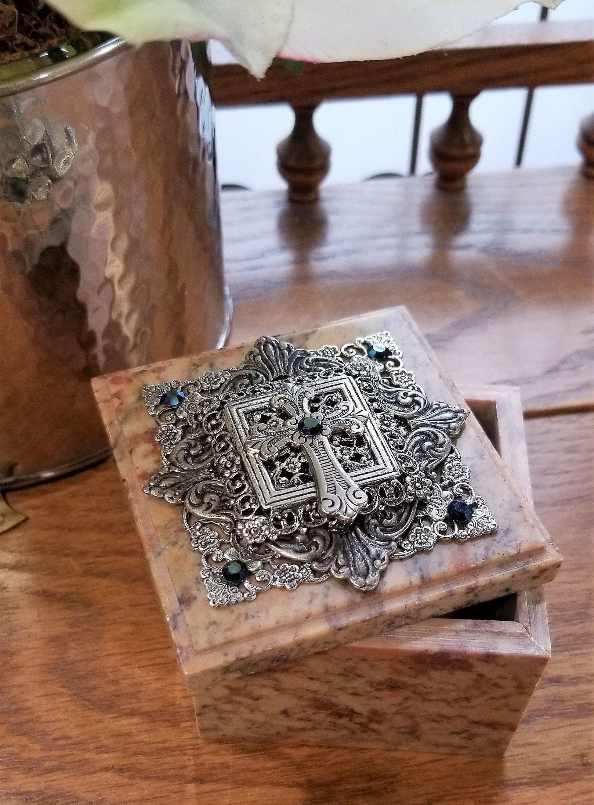 Dacole Designs baptism keepsake box with ornate silver cross decoration on a marble lid