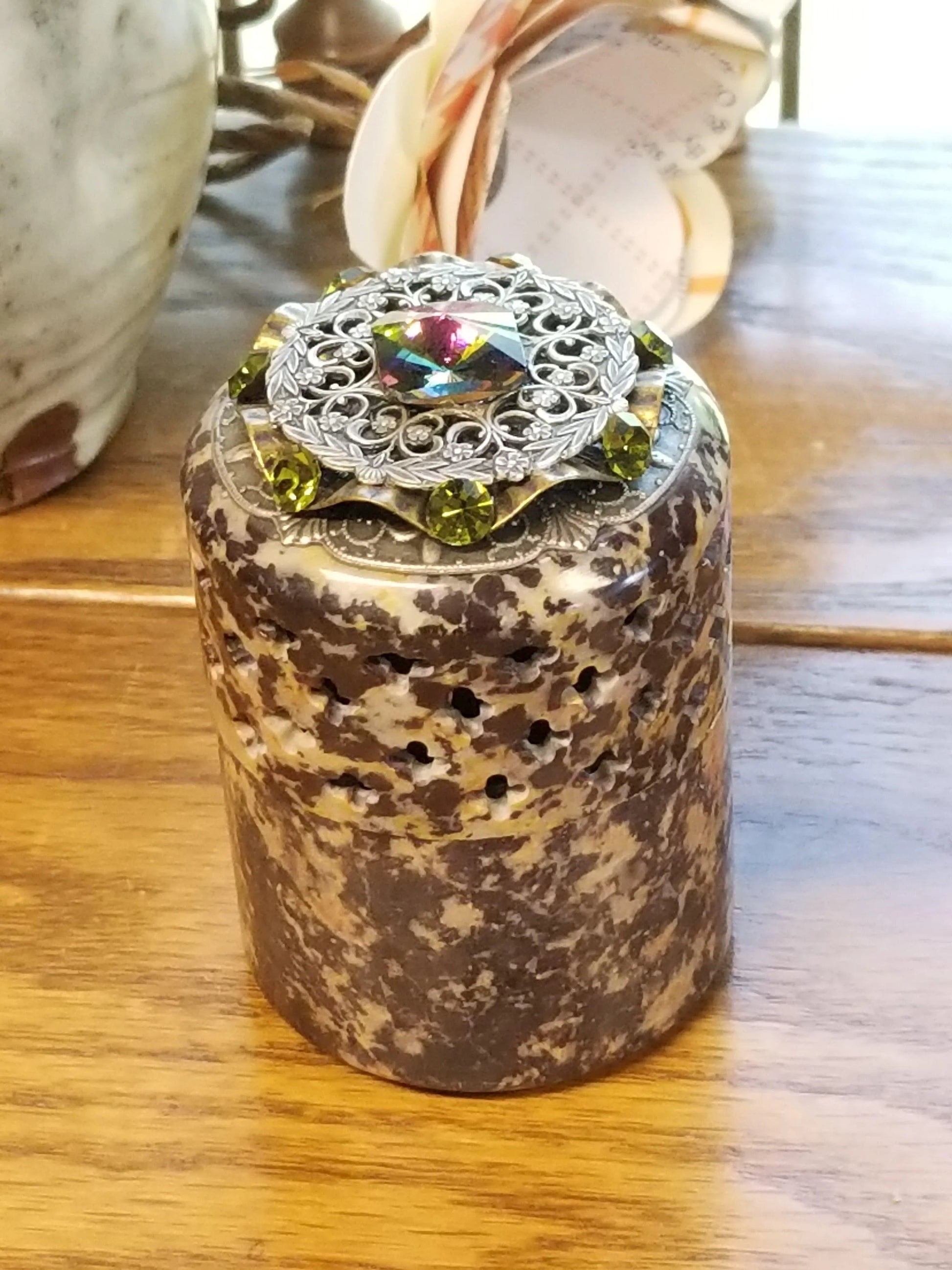 Dacole Designs handcrafted soapstone keepsake box with decorative jeweled lid on wooden table