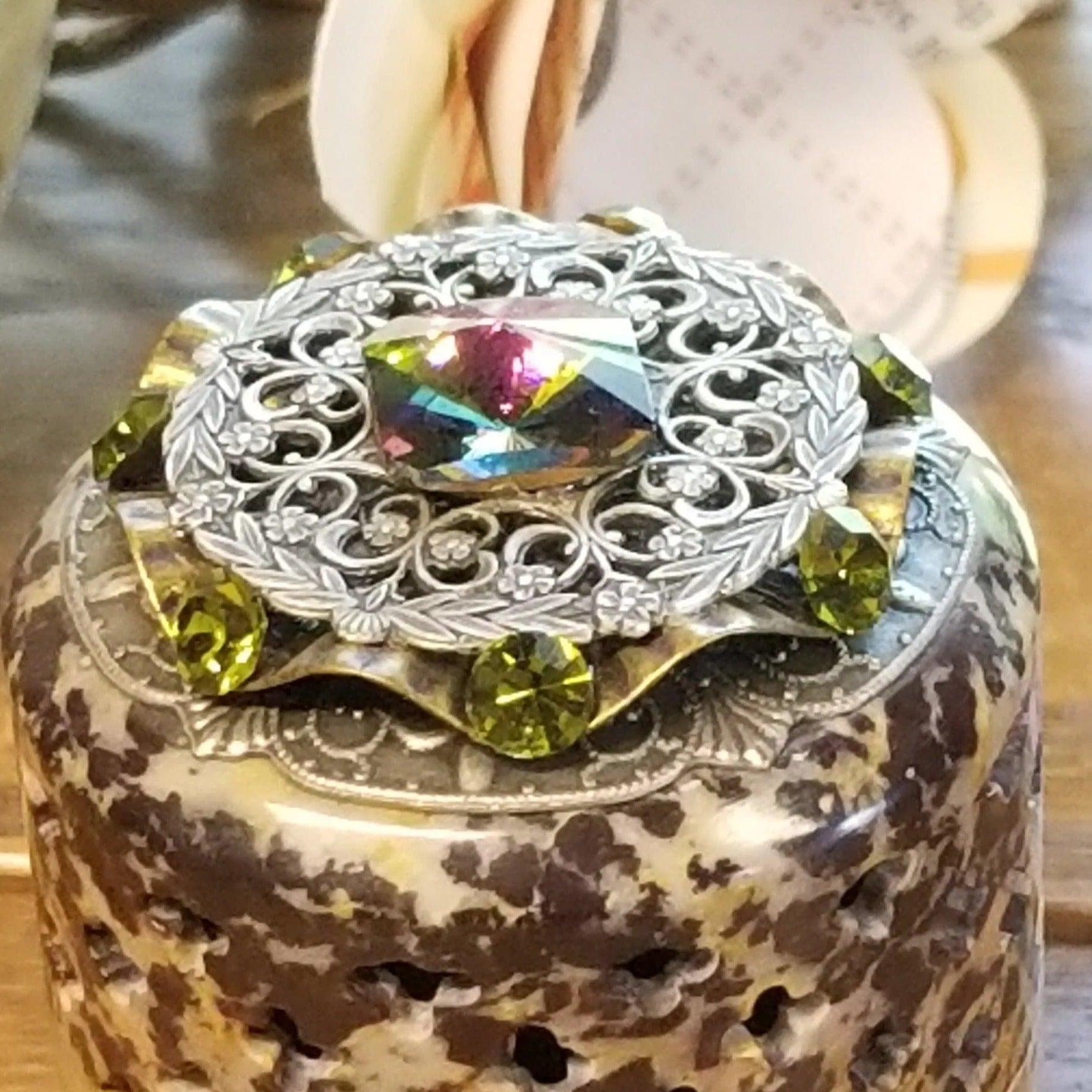 Handcrafted soapstone keepsake box by Dacole Designs with ornate silver filigree and colorful gemstones