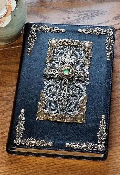 Dacole Designs personal size jeweled bible with cross featuring ornate metalwork and green gem on black cover