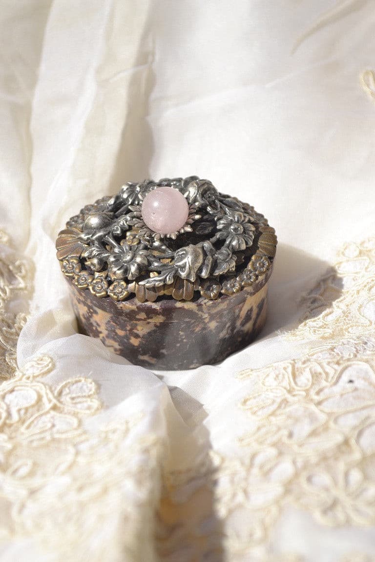 DeMartineau jeweled soapstone keepsake box with intricate floral metalwork and pink stone accent on lid
