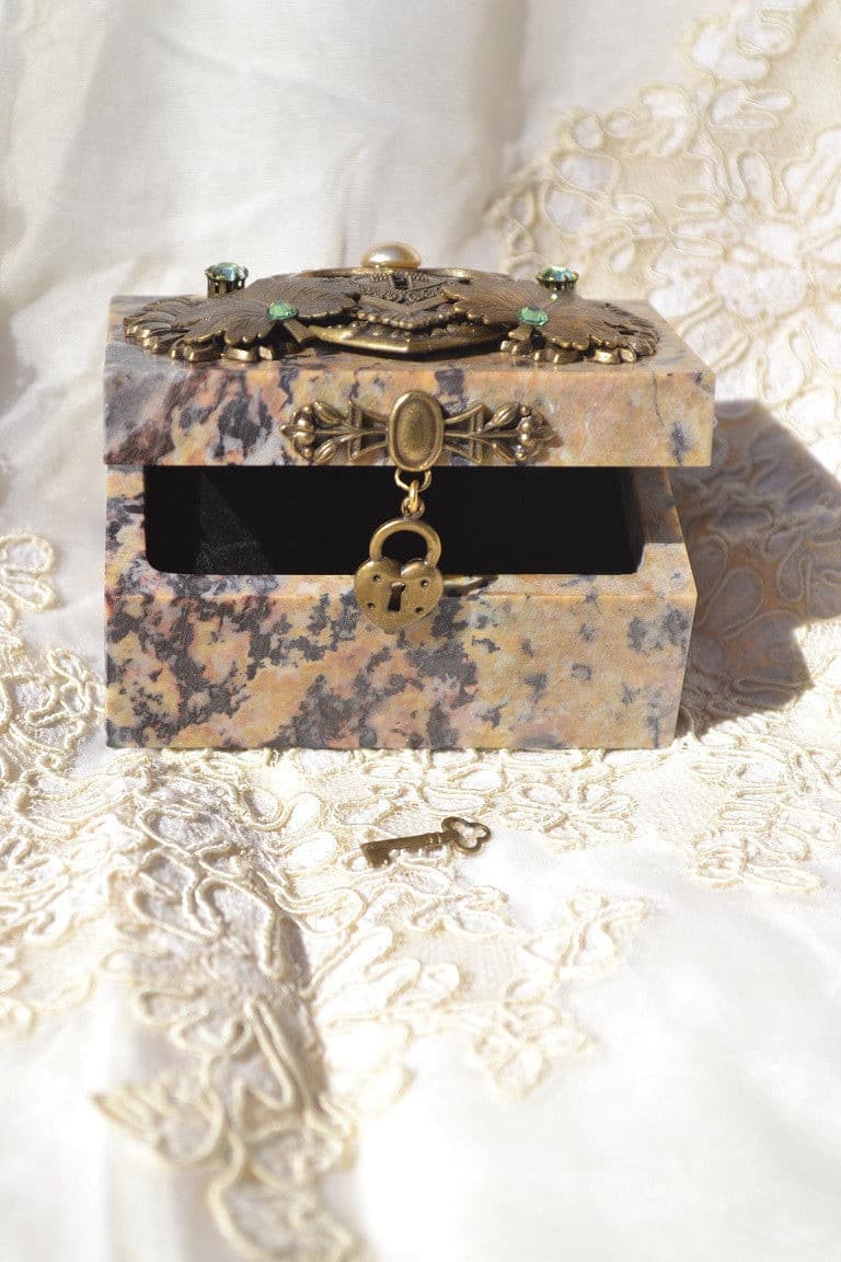 Dacole Designs jeweled soapstone keepsake box with ornate lock and key on lace fabric