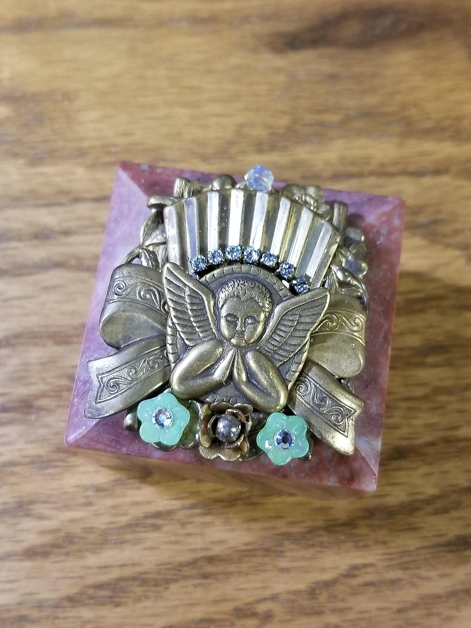 Dacole Designs jeweled angel keepsake box with ornate metal angel and floral accents on pink base